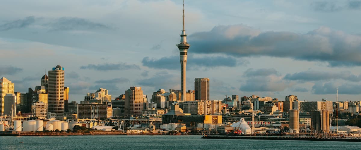 Sky Tower which includes a city, modern architecture and a sunset
