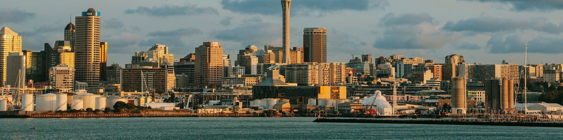 Sky Tower which includes a city, modern architecture and a sunset