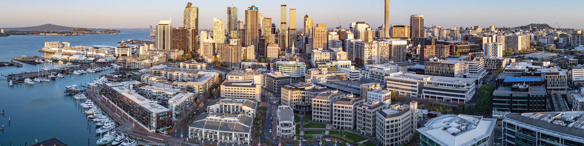 Aerial: Panoramic view of Auckland city skyline from viaduct harbour, New Zealand