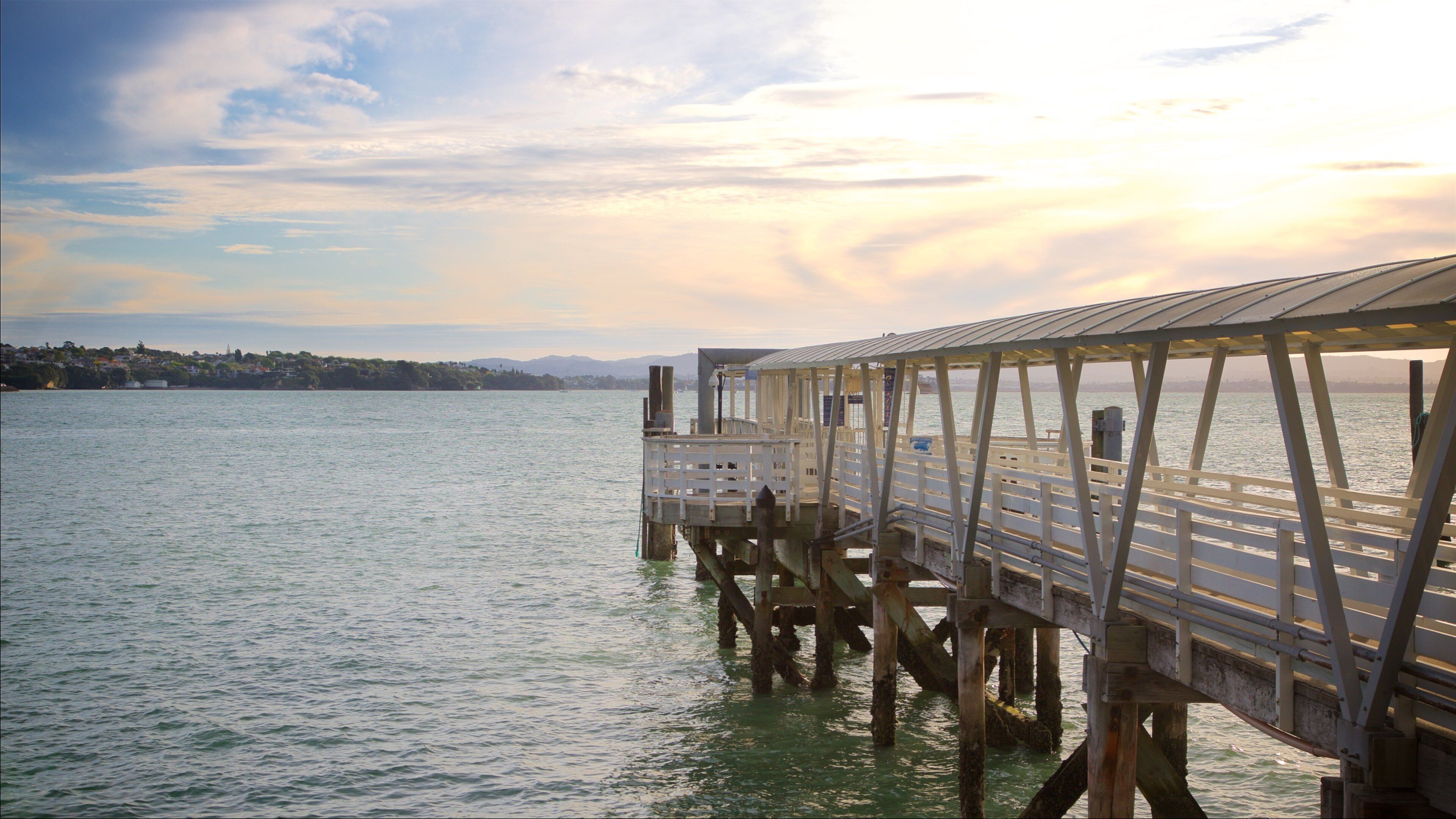 Auckland Harbour Bridge which includes a sunset and a bay or harbor