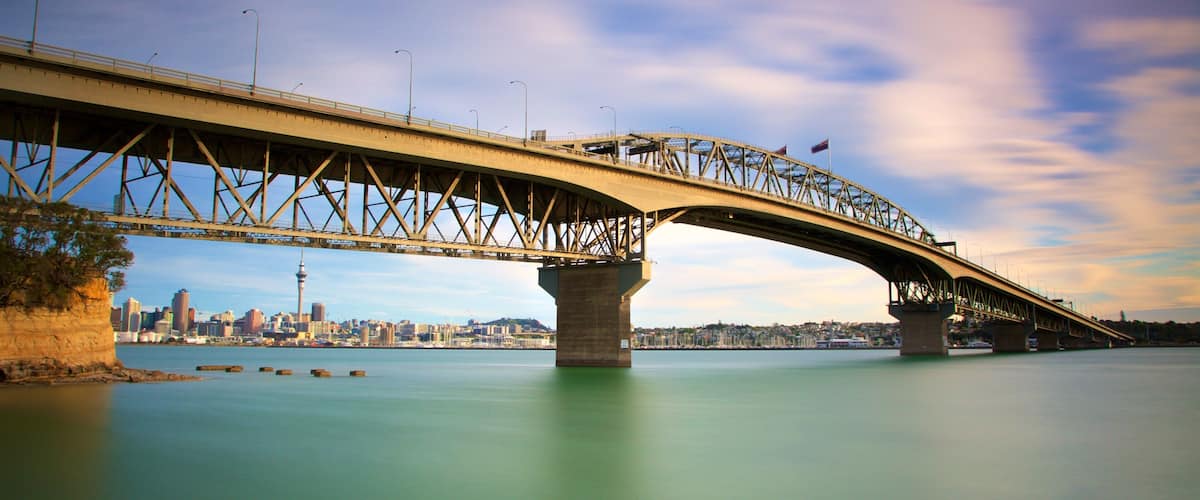 Harbour Bridge showing a bridge, a sunset and a bay or harbour