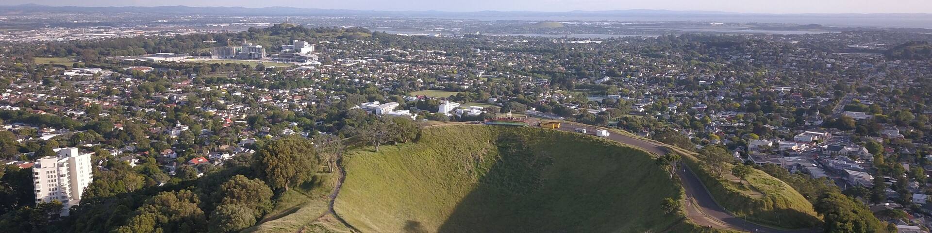 Mount Eden, Auckland / New Zealand - December 10, 2019: The Legendary Volcano location of Mount Eden and the skyline of Auckland