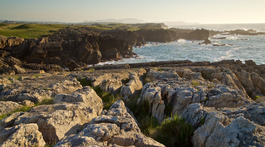 Santander - Cantabrian Coast which includes rocky coastline, a sunset and general coastal views