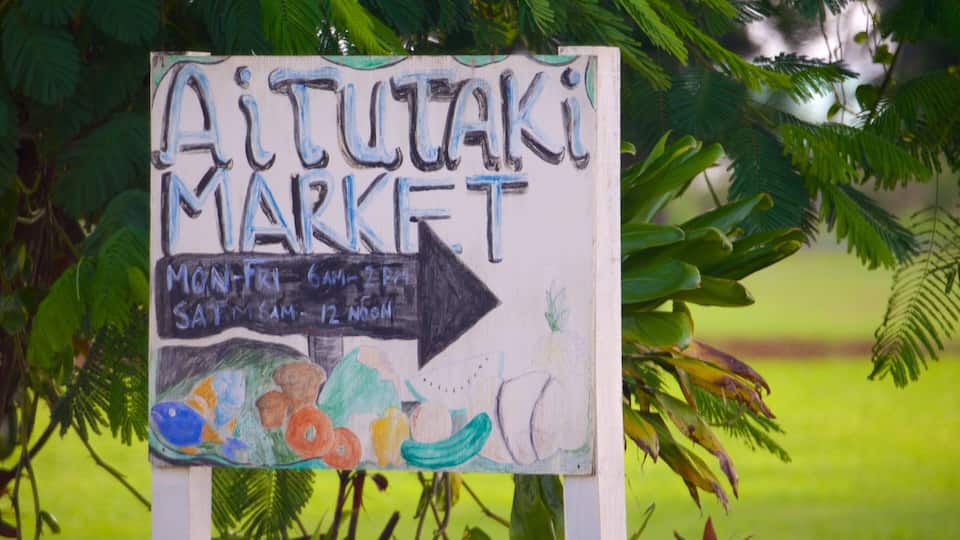 A sign for Aitutaki Market with an arrow pointing to the right.