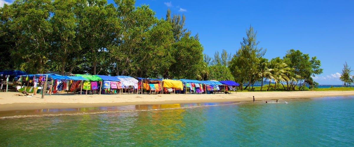Mele Bay which includes a sandy beach and tropical scenes
