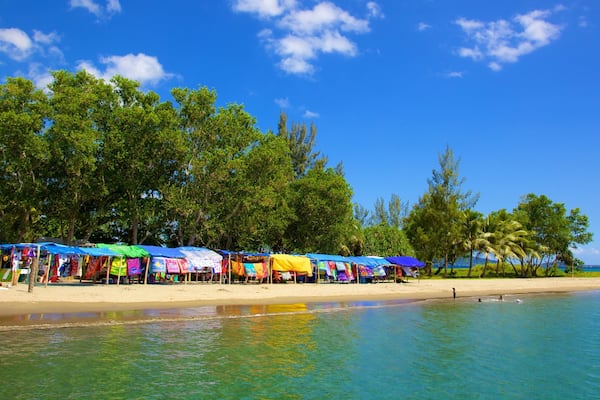 Mele Bay which includes a sandy beach and tropical scenes