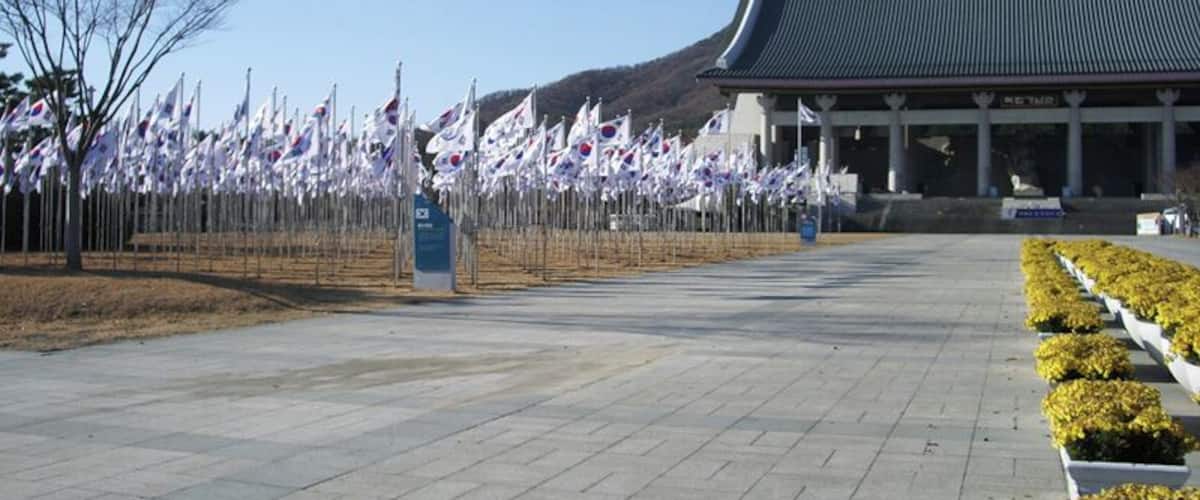 Closing in on the main hall. Now I see 815 flagpoles of varying heights, displaying the national flag. Quite a sight. Of course, 815 is a significant number because it marks August 15th; on that date in 1945, Japan surrendered to the Allies to end World War II, and per the provisions of Potsdam Declaration, Japan's rule over Korea ended. However, the euphoria was short lived, as the Soviets, who had entered the war against Japan only six days before, were busy marching into northern Korea already, and the US hastily proposed dividing Korea at the 38th Parallel for a split Soviet-American trusteeship rule until the mess could be sorted out. Three years later, on August 15th, 1948, the Republic of Korea was proclaimed. However, due to continuing Soviet-American disagreements, the UN-monitored elections for the first Republic of Korea government were limited to the American sector, and the Republic of Korea ended up only being the southern government. By September 9th of the same year, Democratic People's Republic of Korea was set up in the Soviet sector, and Korea was permanently divided.
