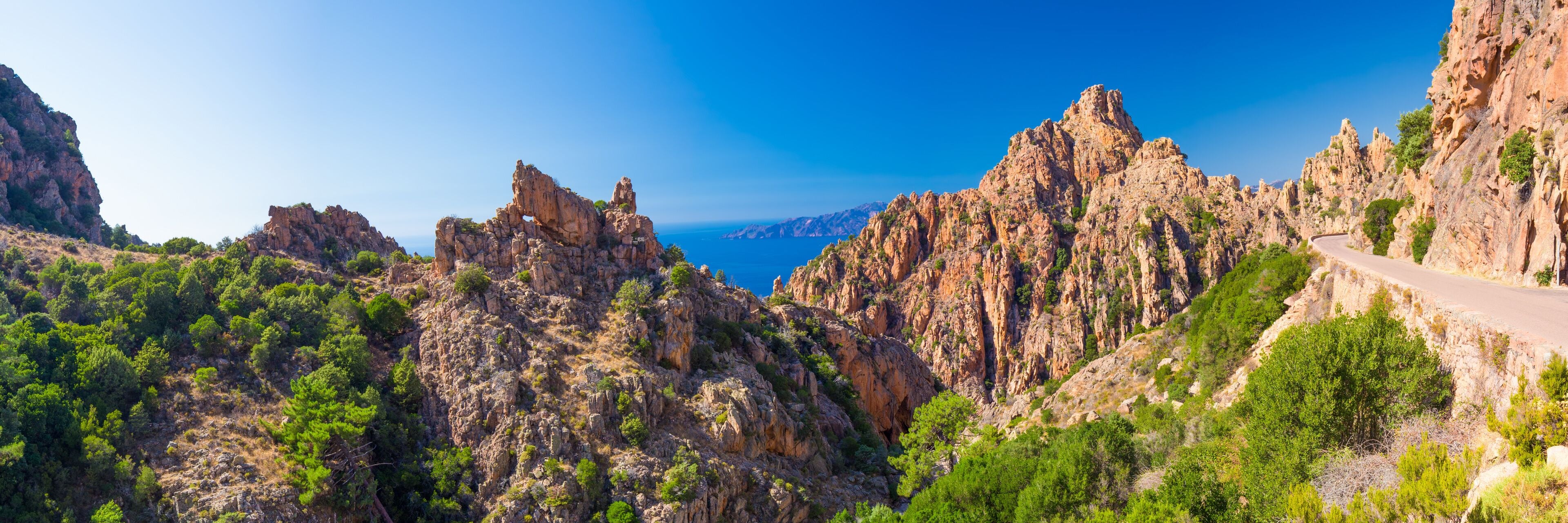 Calanques de Piana with the D81 coastline road on the west coast of Corsica, France