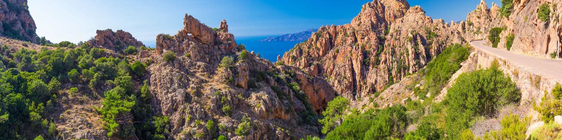 Calanques de Piana with the D81 coastline road on the west coast of Corsica, France