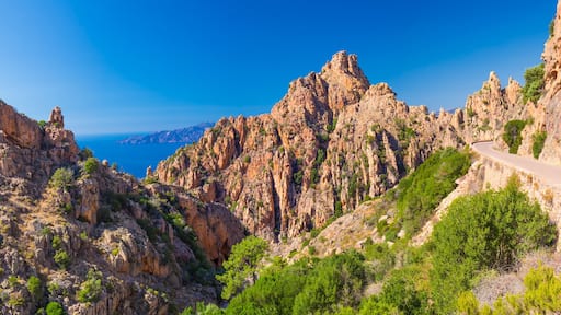 Calanques de Piana with the D81 coastline road on the west coast of Corsica, France