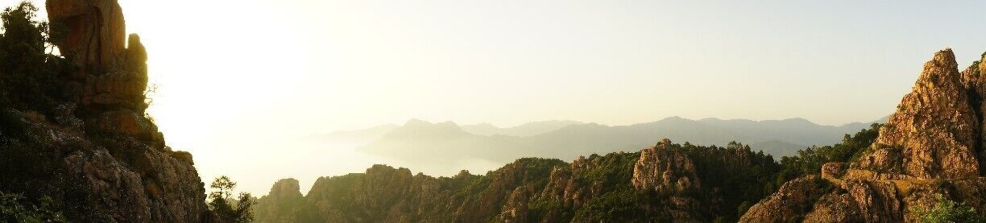 The red/orange cliffs during sunset somewhere between Porto and Piana in Corsica. The place, called Les Calanches de Piana, is famous for the astonishing mountain formations.