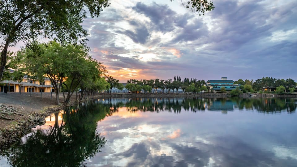 Blue hour sunset with dramatic sky reflected in water