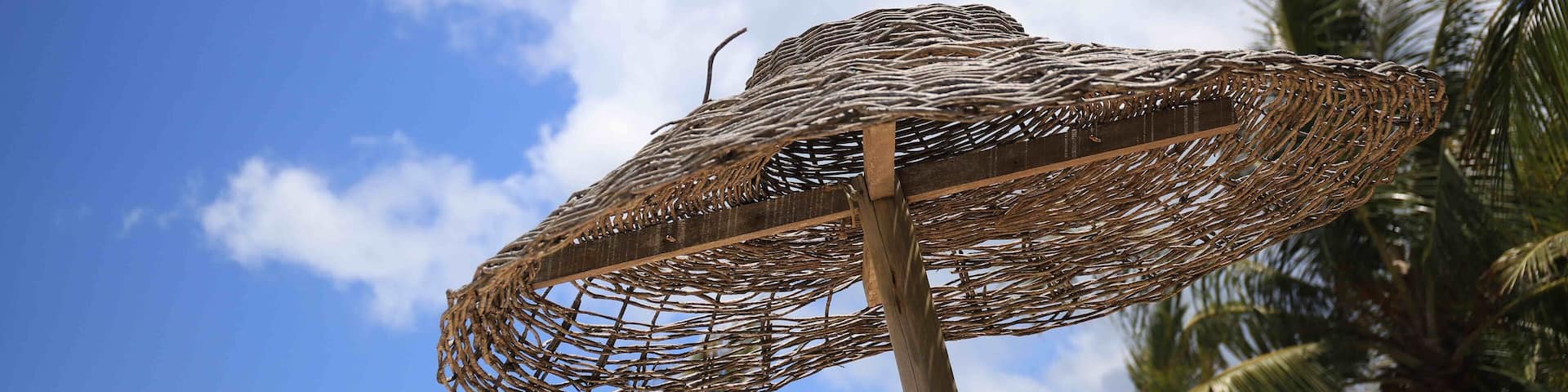 Umbrella in front Bar Uxua .The best day use in Trancoso. Ask about “caipirinha “ drink.