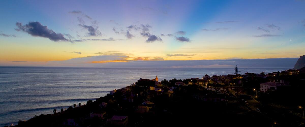 Paul do Mar featuring a coastal town and a sunset