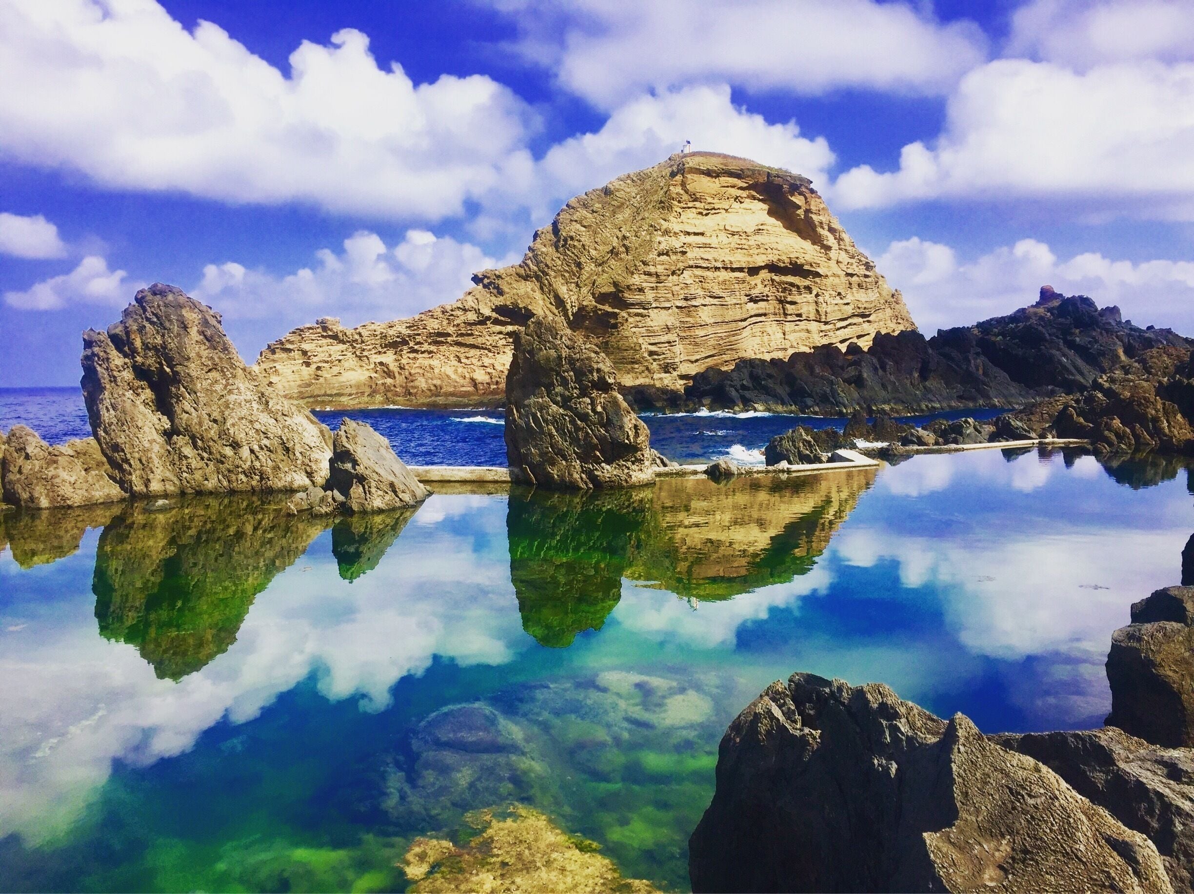 Beautiful natural swimming pool in Porto Moniz in Madeira. Amazing reflections when the sun is shining!