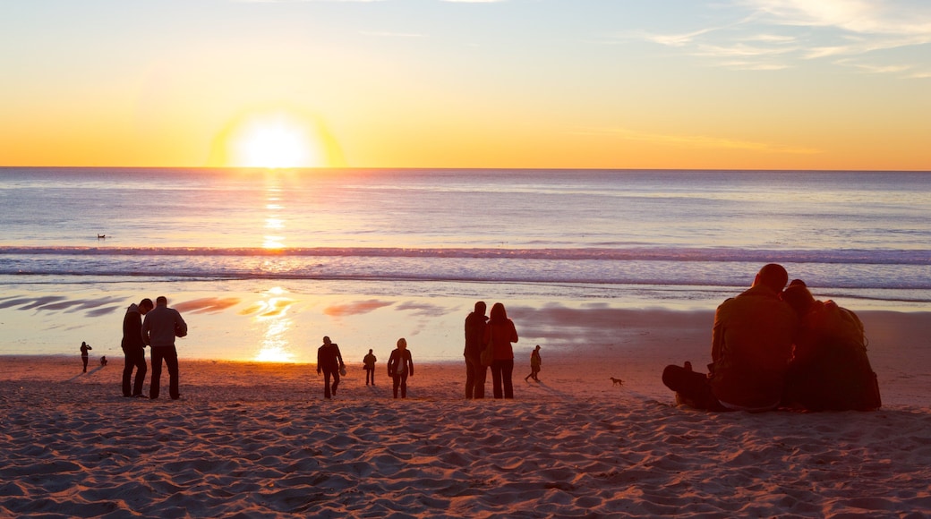 Central California which includes a sunset, a beach and a bay or harbor