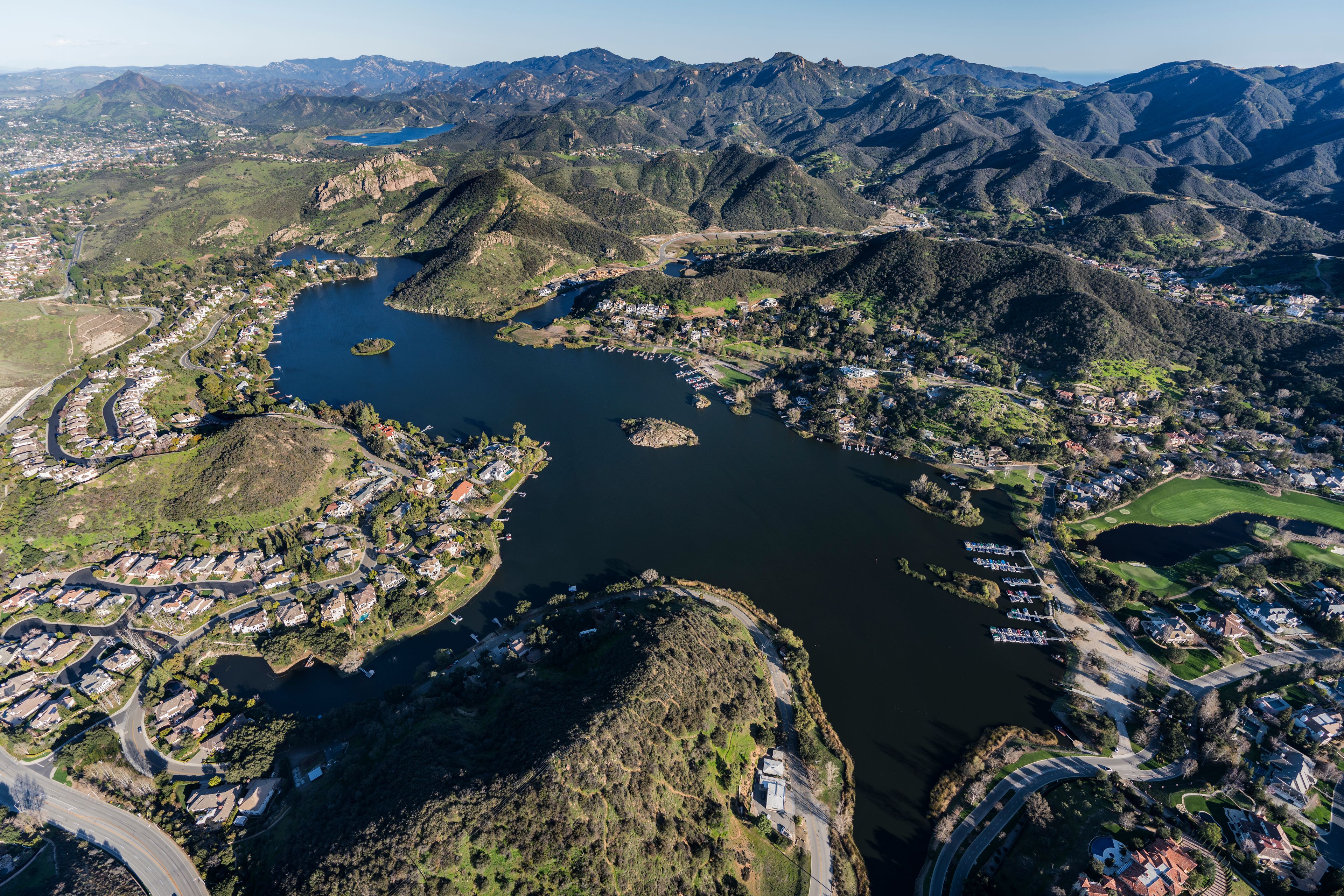Aerial view of Lake Sherwood homes and the Santa Monica Mountains near Westlake Village and Thousand Oaks, California.