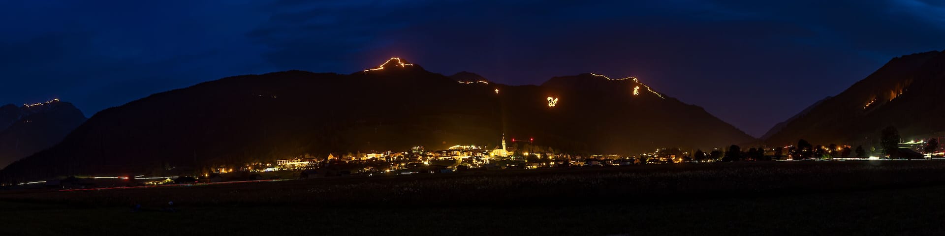 Traditional mountain bonfires for the summer solstice in the Tiroler Zugspitz Arena near Ehrwald