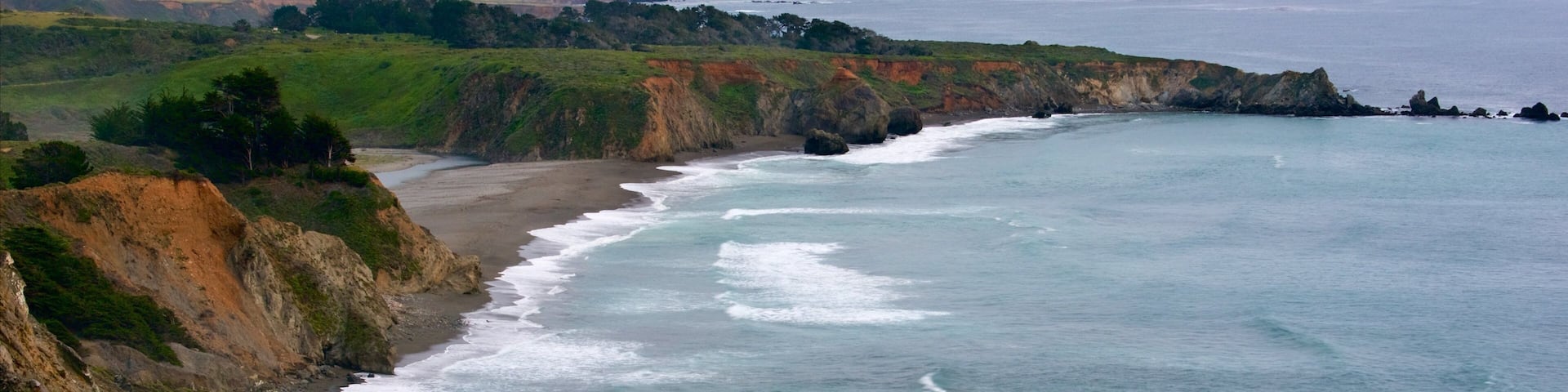 Ragged Point showing landscape views, a bay or harbor and rugged coastline