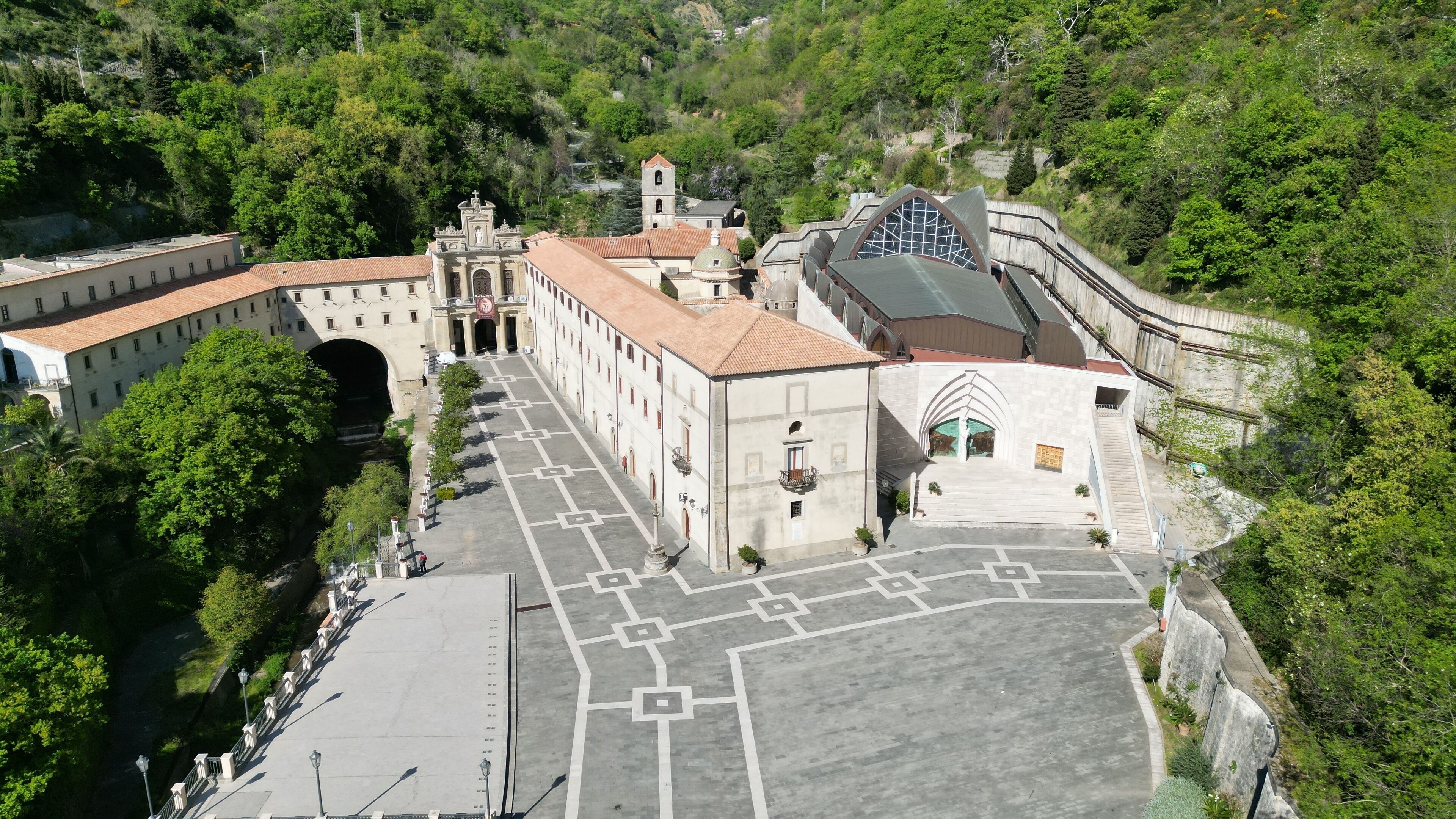 A historic church with a bell tower and a large arched entrance.