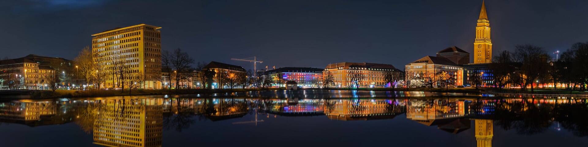 Kiel skyline at night. View from the water of the Kleine Kiel.