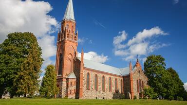 A historic church with a tall tower and arched windows.