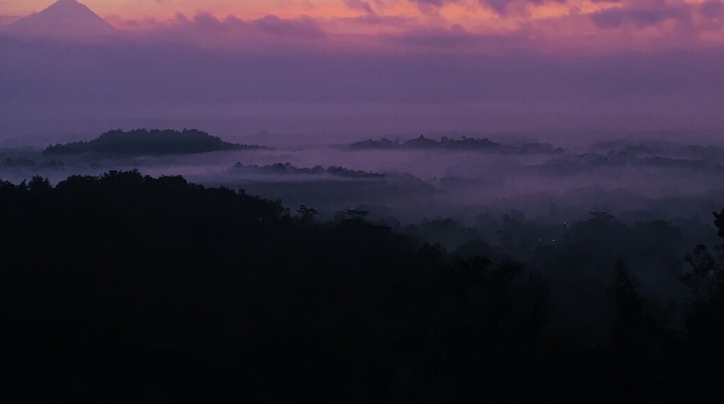 Bendung hill during sunrise: it looks like landscape was carefully painted in watercolor.
Borobudur’s temple and one volcano in the background complete the full experience.