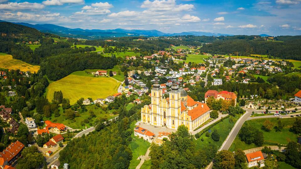 Aerial panoram of Baroque Mariatrost Basilica on top of the Purberg hill in Mariatrost, a district of Graz.