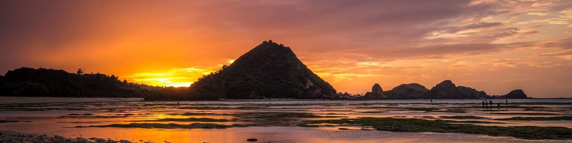Sunrise with a low tide could create some very neat pictures. I was too late to take advantage of getting closer to the people out gathering the different types of seafood left stranded by the low water.