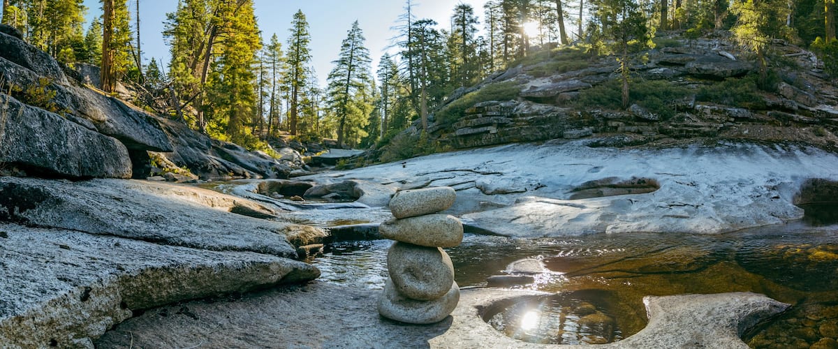 Panoramic View of a Stone Cairn on a Granite Riverbed in Desolation Wilderness, California