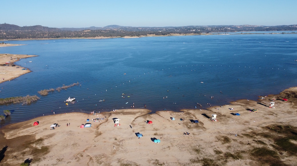 Granite Bay, Folsom Lake, California - July 31, 2026: Aerial view of low water levels, exposed shoreline, and crowded beach