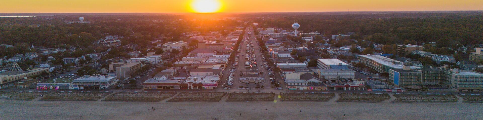 Aerial view of the beach and city at the sunset in Rehoboth Beach, Delaware. Delaware beaches. Delaware coastline. Aerial ocean view.