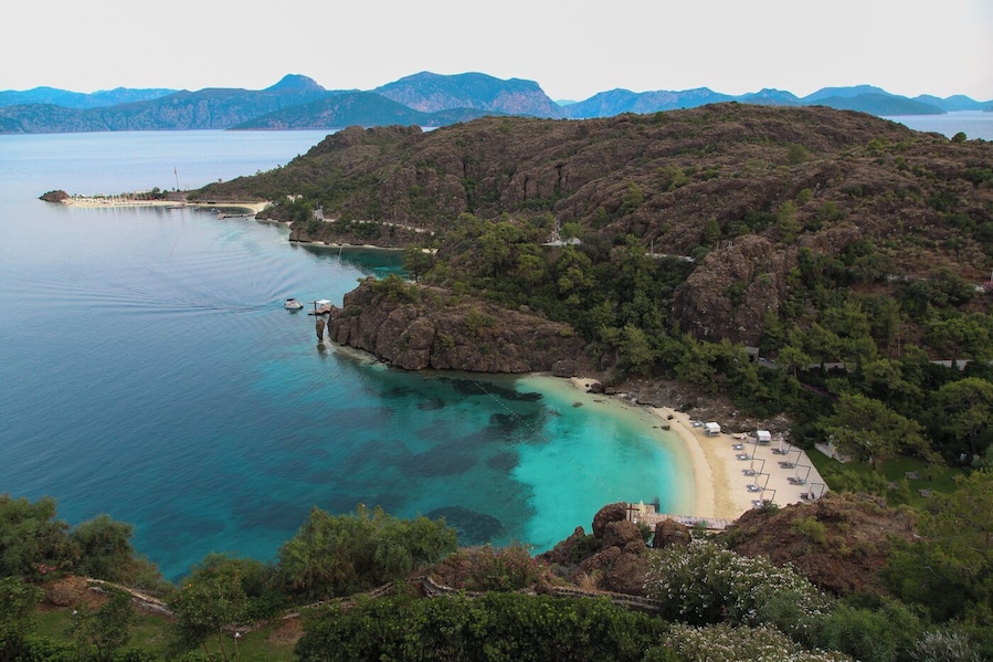 D-Hotel Maris in Mugla, Turkey is a slice of heaven if you enjoy white sandy beaches combined with stunning views of the nearby mountainous islands. The resort has a total of 5 natural sand beaches. You can choose between a few beaches on the main property or you can venture by water taxi to the quiet beach (lower right) or the newest beach (upper left) that features an afternoon DJ performance. Beach-wise, you can't go wrong! #beach