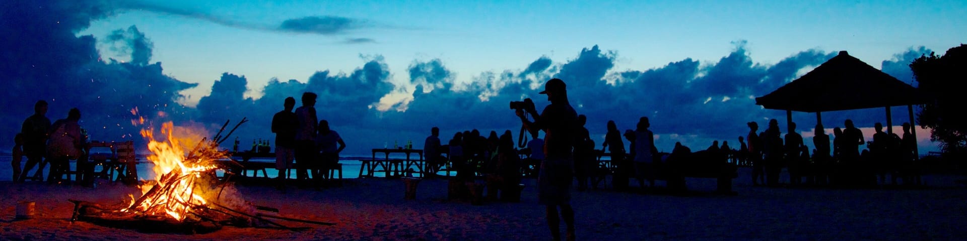 Gili Islands featuring night scenes as well as a large group of people