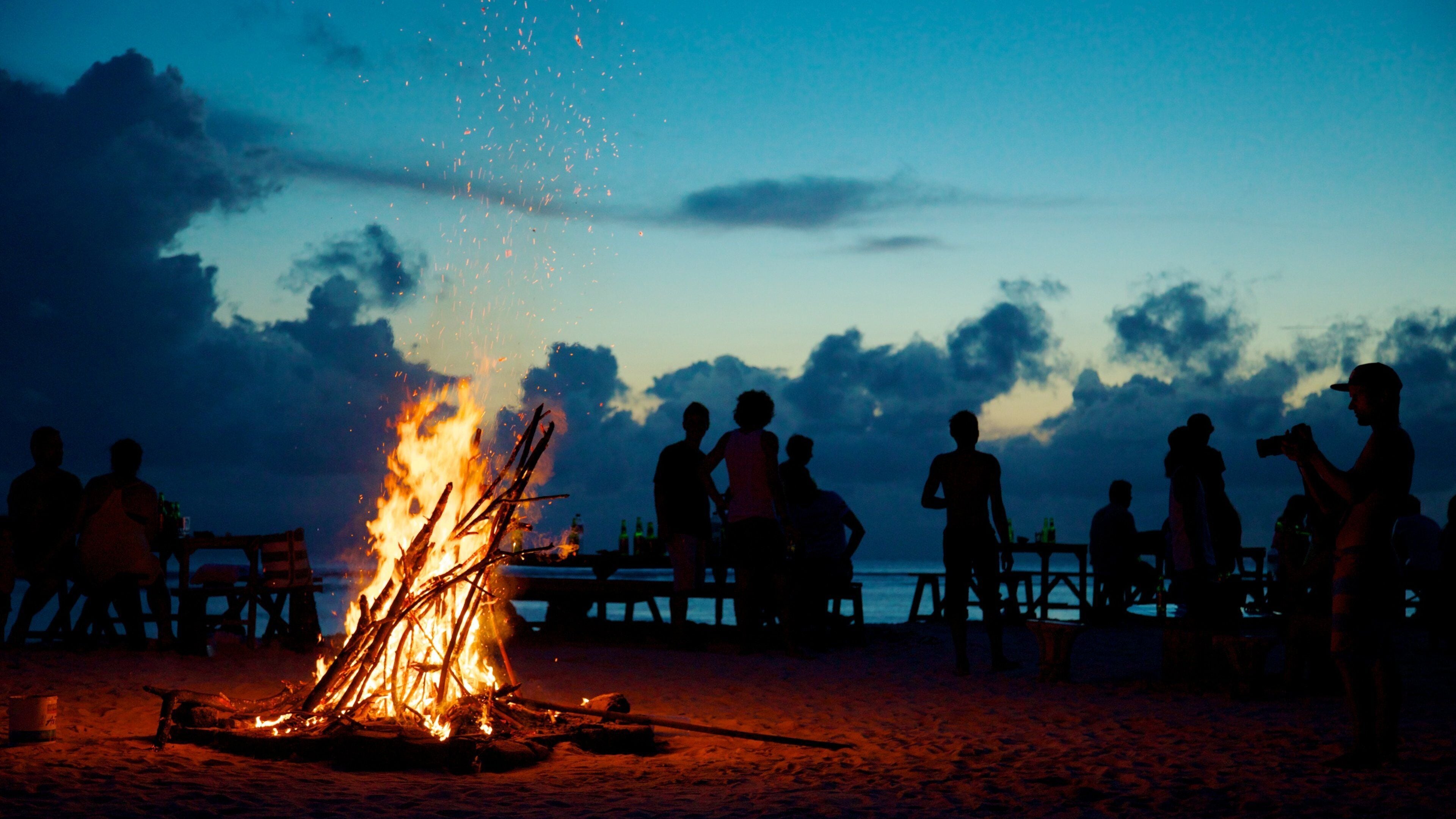 Gili Islands featuring a beach, night scenes and a sunset