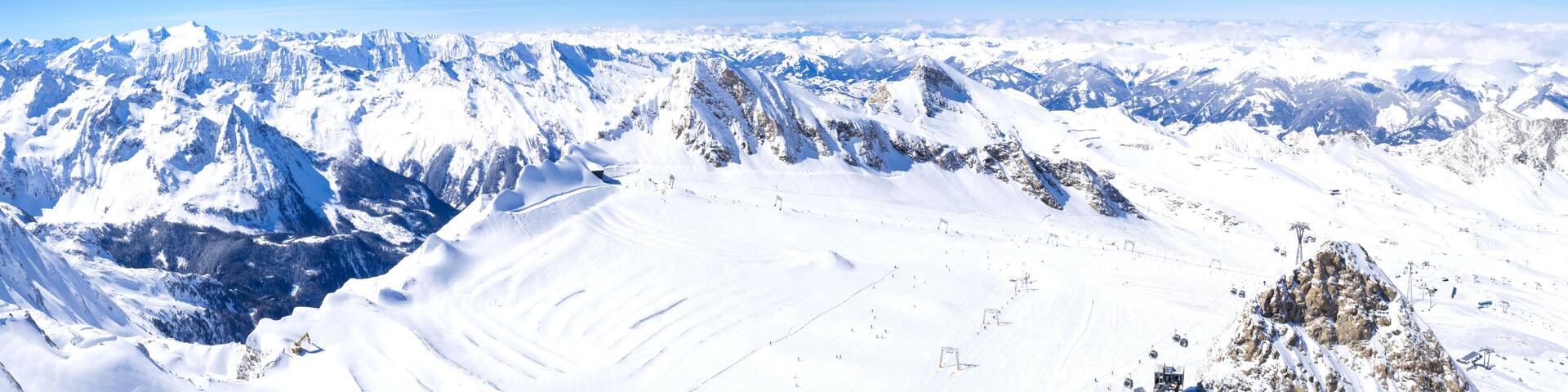 A snow-covered mountain range with clear skies.