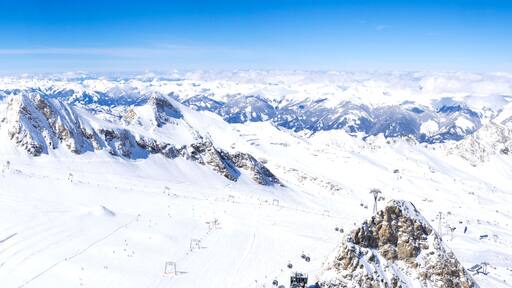A snow-covered mountain range with clear skies.