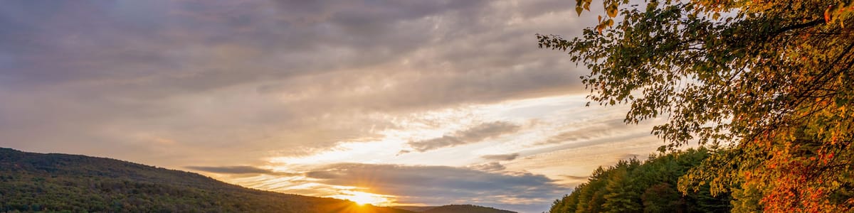 Roundout Resevoir in Catskill mountains of New York in sunset time. Colorful trees and calm lake