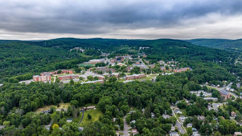 Oneonta, NY, USA - June 7, 2026: Late afternoon spring aerial photo of SUNY Oneonta campus in Oneonta, NY after the end of the spring semester.