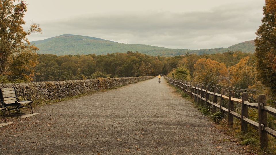 The Catskill mountains in the background of lake and autumn walk