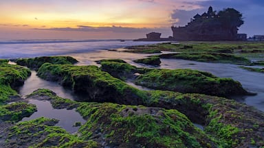 Sunset over Tanah Lot temple in Canggu, Bali, Indonesia.