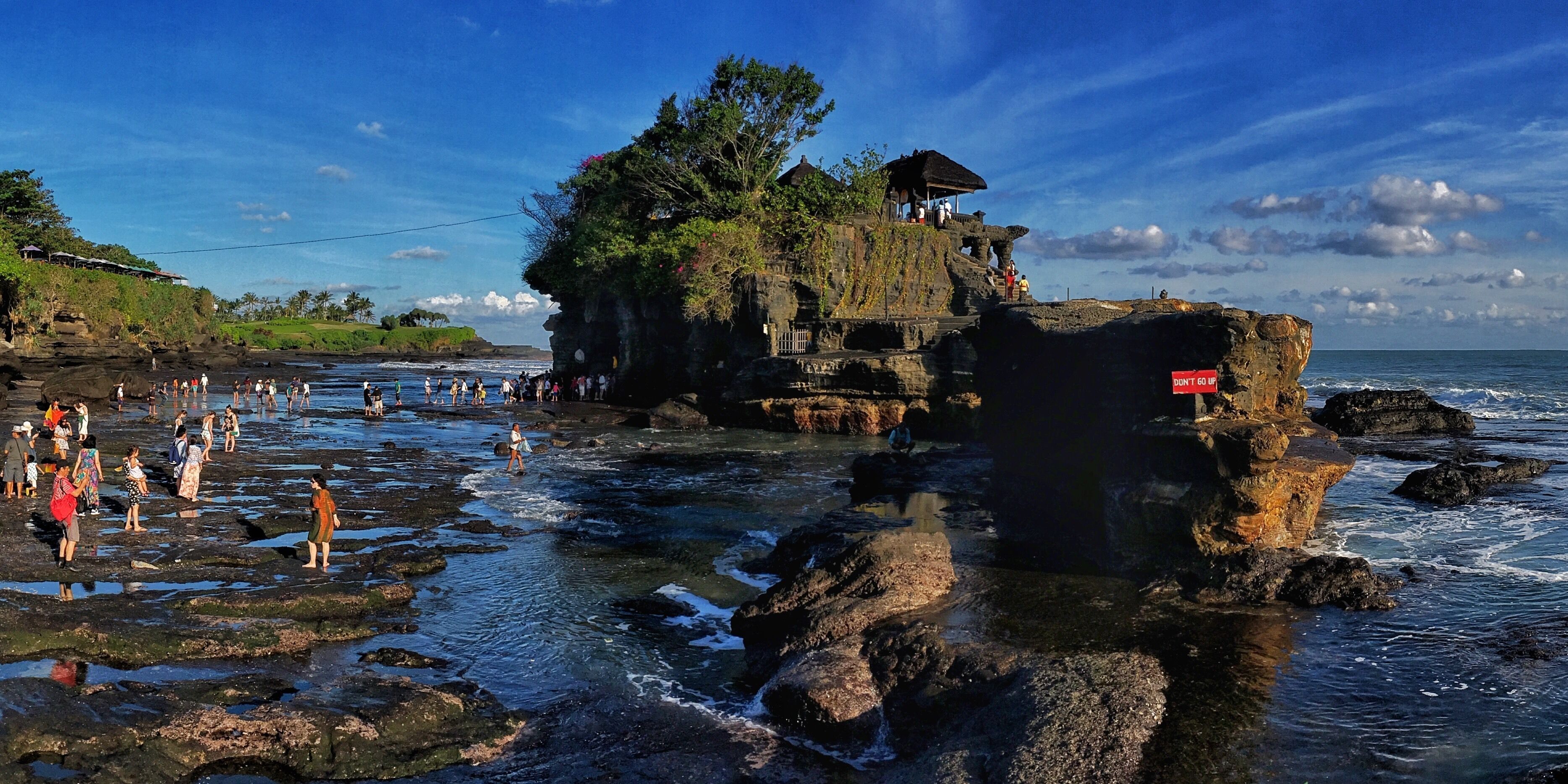 Magical place.  Walking across the shallow surf to get to the temple.