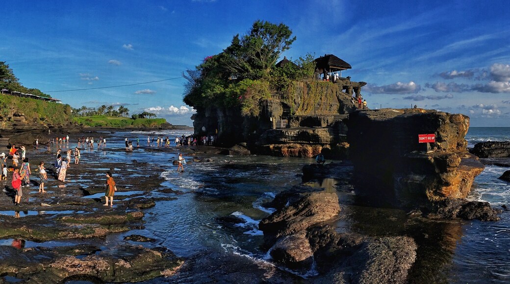 Magical place. Walking across the shallow surf to get to the temple.