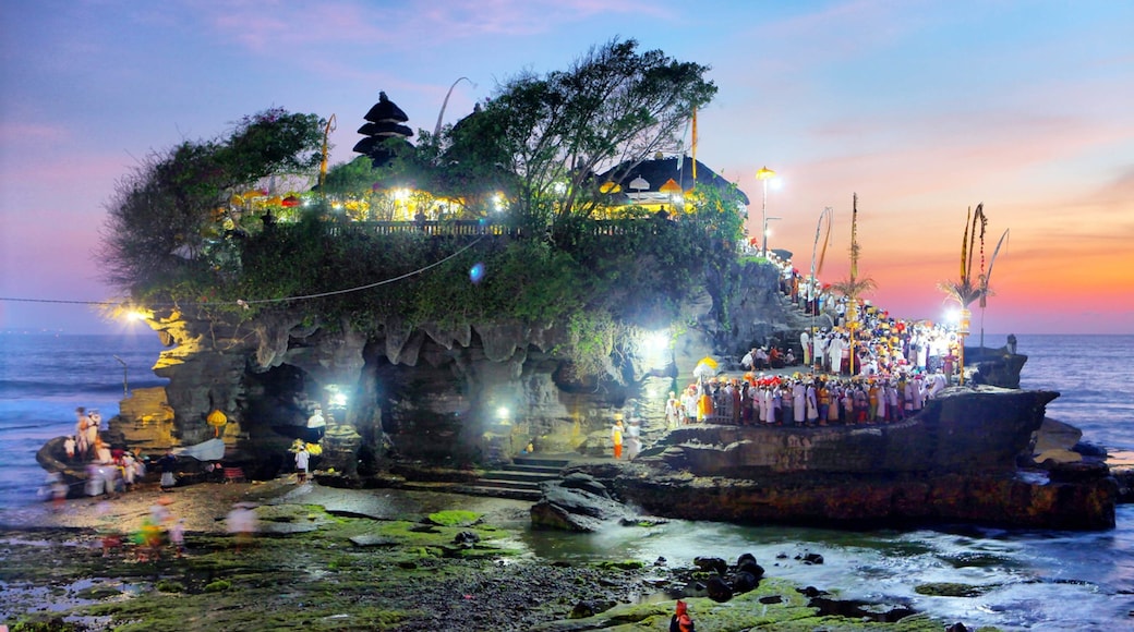 Tanah Lot featuring general coastal views, island views and a sunset