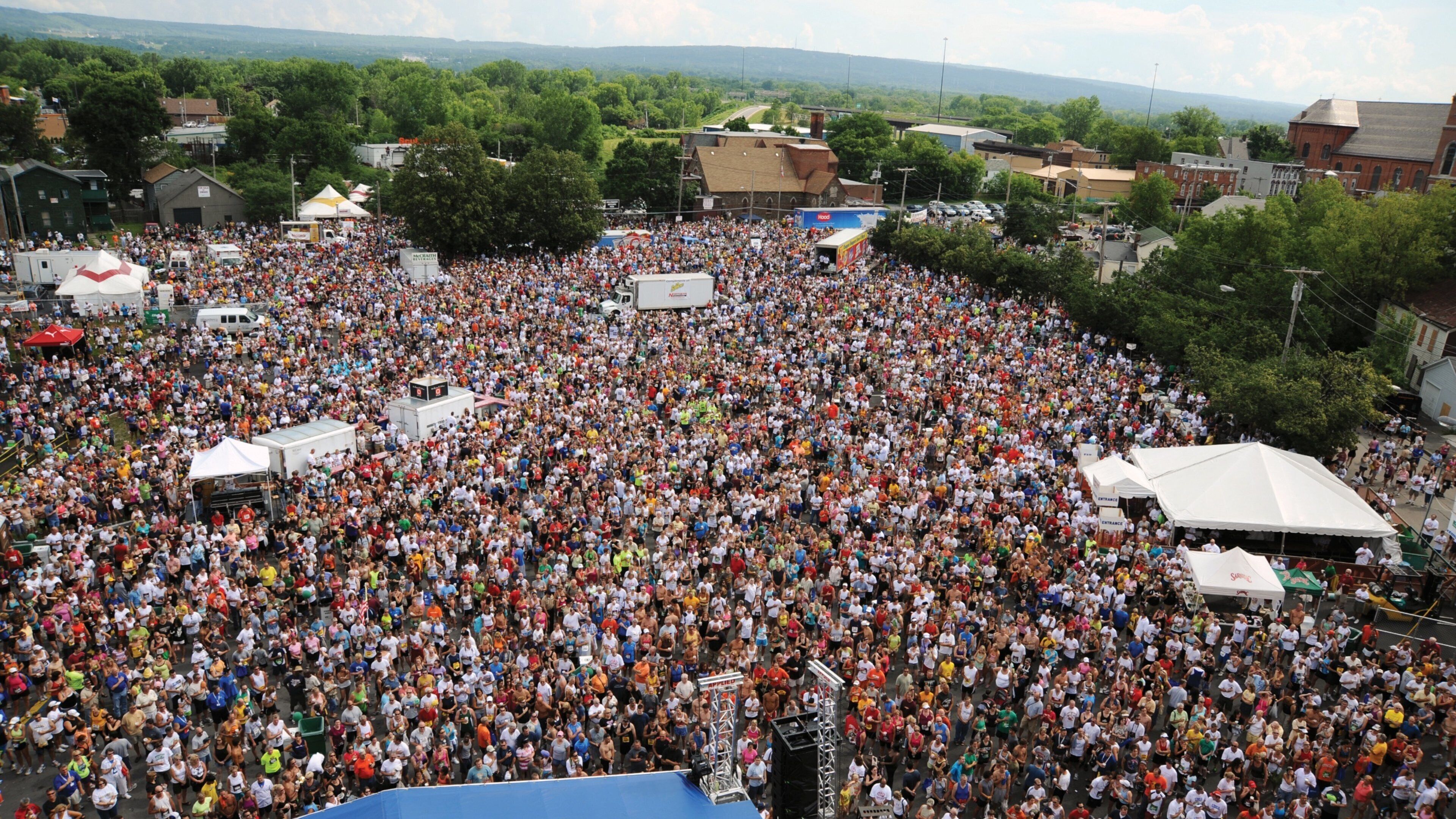 Utica showing a festival as well as a large group of people