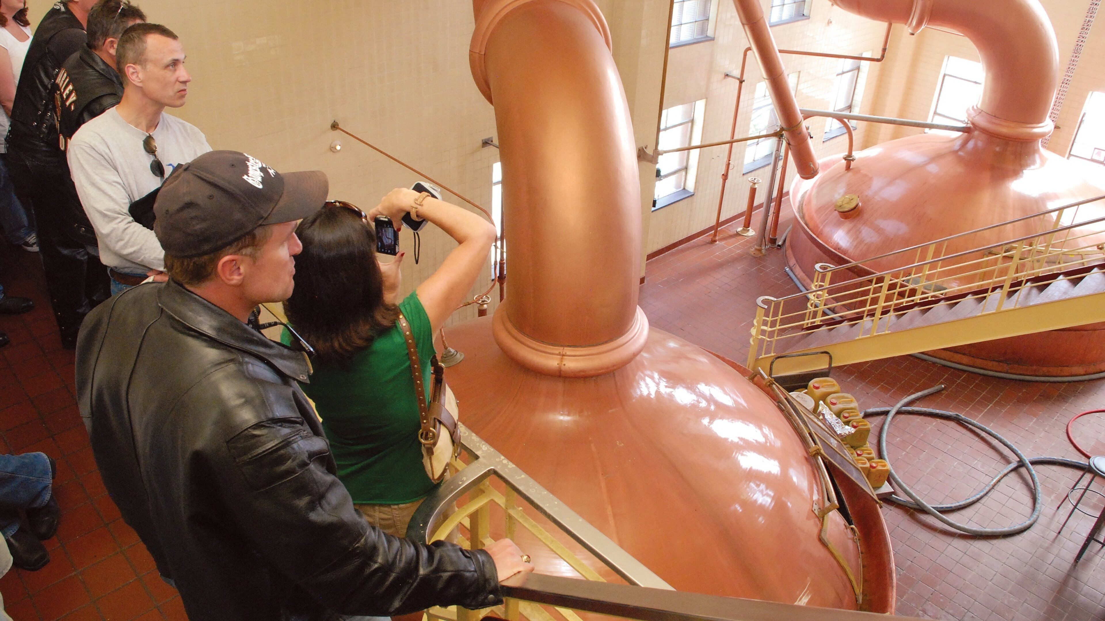 Utica featuring interior views as well as a small group of people