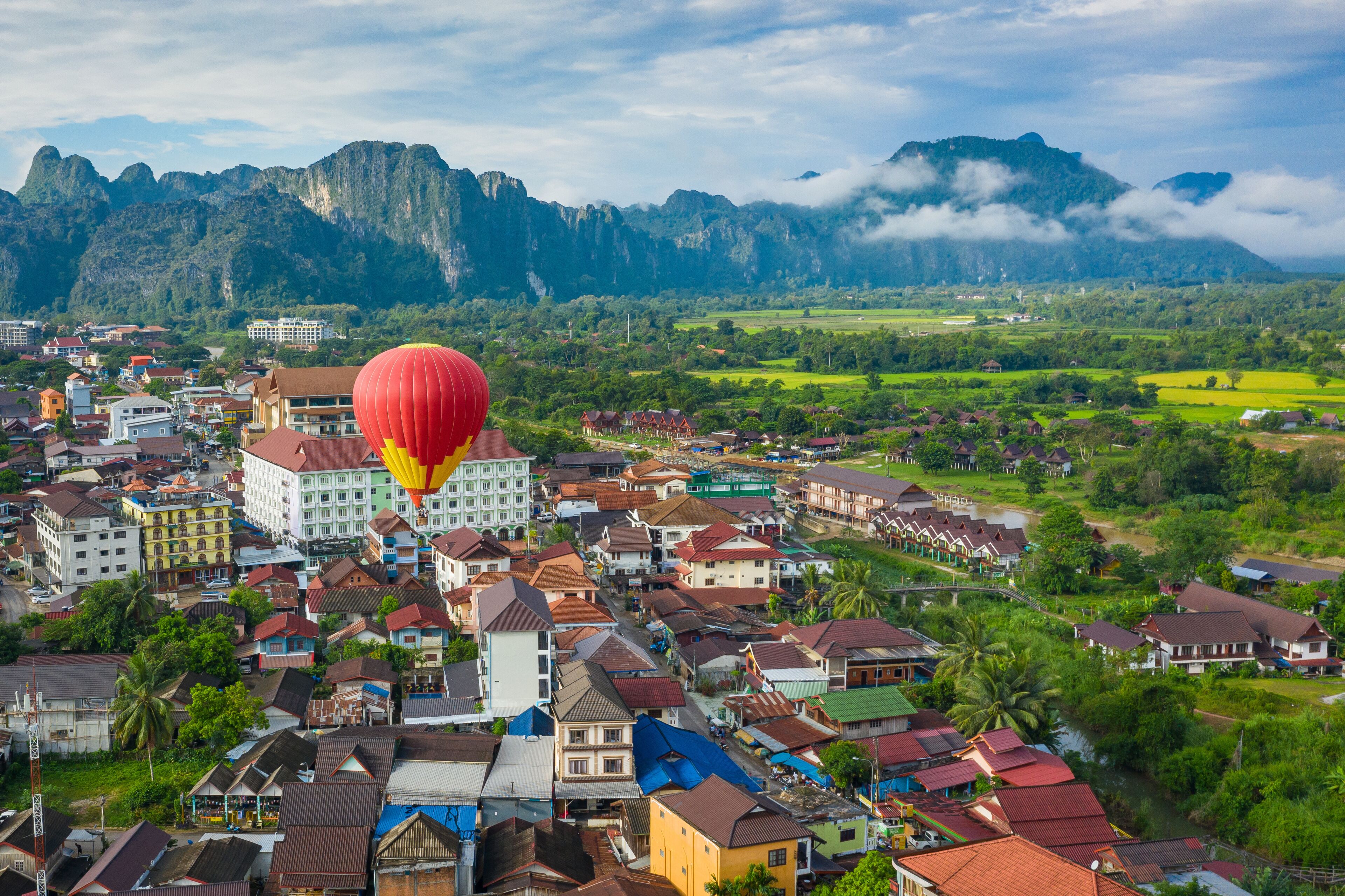 Hot air balloon over Nam Song river at sunrise in Vang vieng, Laos. Asia.