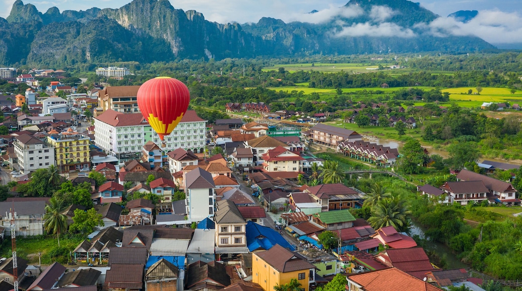 Hot air balloon over Nam Song river at sunrise in Vang vieng, Laos. Asia.