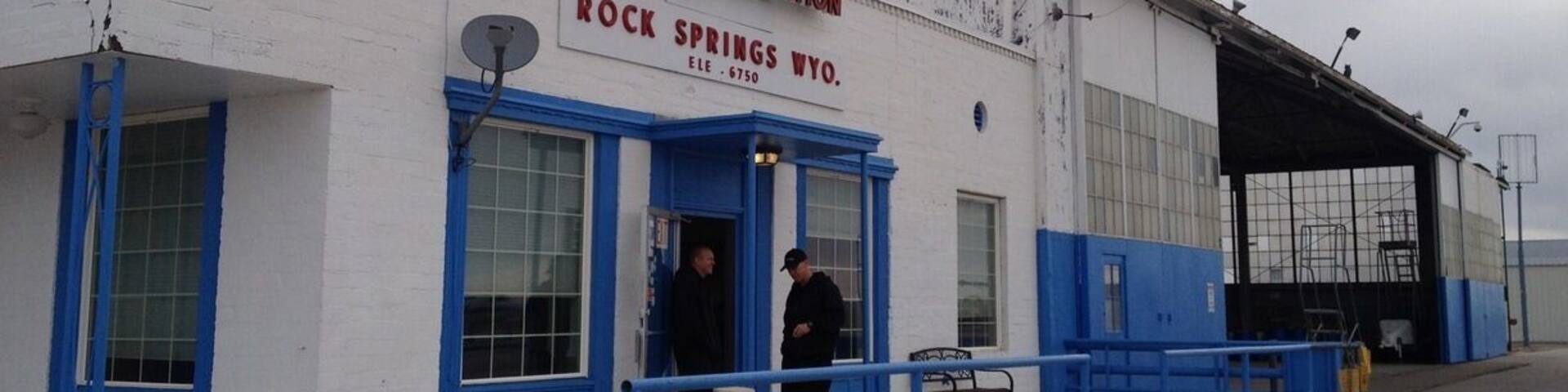 A building with a sign reading "General Aviation Rock Springs, Wyo."