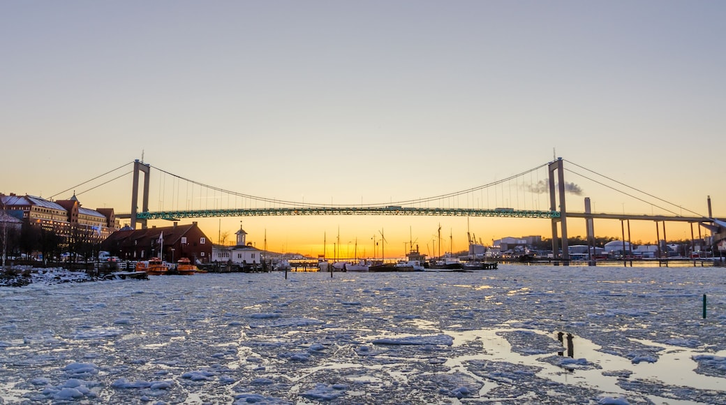 Gothenburg - Beautiful sunset at frozen Gota river with Hisingsleden Bridge in the harbor district during winter